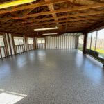 garage with framed roof and epoxy floors