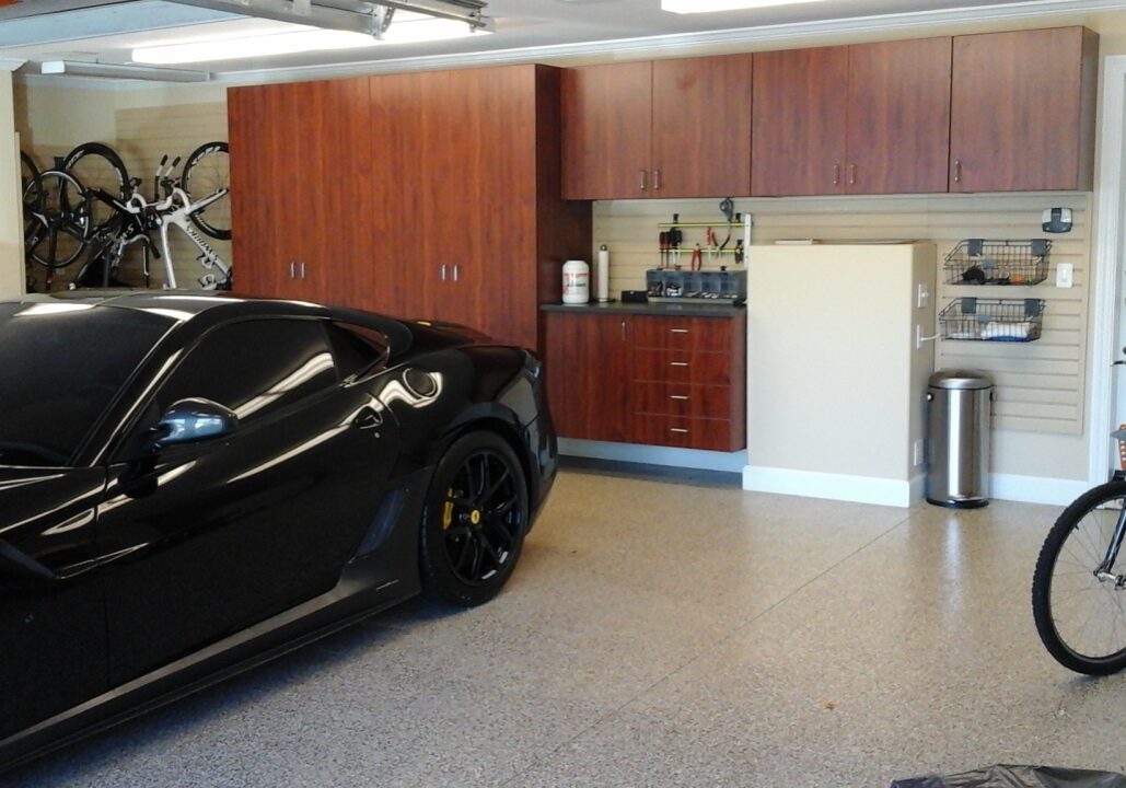 Wooden garage cabinets in a workstation with epoxy floor coating; San Francisco